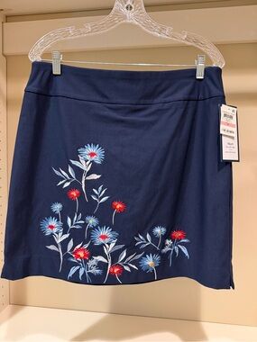 This Charter Club skort features a dark blue fabric w/colorful embroidery.